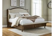 Sturlayne King Upholstered Panel Bed In Brown
