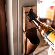 The Cooter Brown Personalized Whiskey Barrel Bottle Opener with detachable leather cap catch pouch