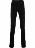 AMIRI Black Stack skinny jeans | Browns 