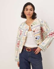 ASOS DESIGN crop collarless quilted jacket in postcard print