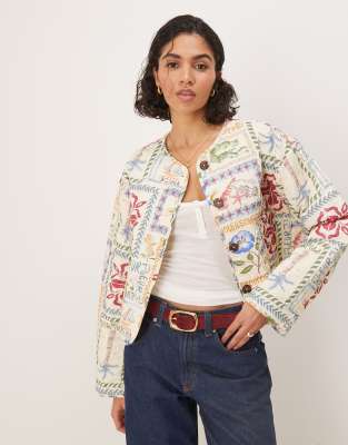 ASOS DESIGN crop collarless quilted jacket in postcard print