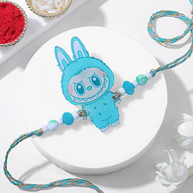 Buy/Send Cheeky Charm Green Labubu Rakhi Online- FNP