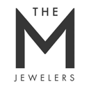 The M Jewelers logo