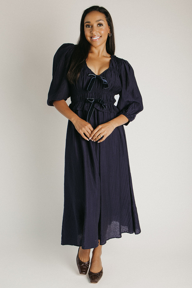 The Travillo Velvet Bow Detail Midi Dress in Navy