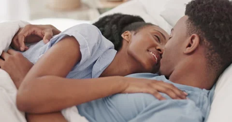 Black couple, kiss and in bed, love and intimate, healthy relationship and