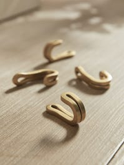 Four Small Brass Hooks