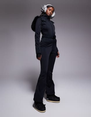 ASOS 4505 Ski soft shell belted ski suit with slim kick leg and faux fur hood in black