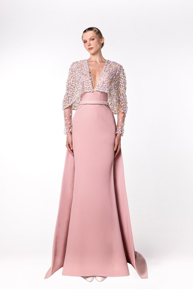 Crepe gown featuring semi sheer embroidered cape